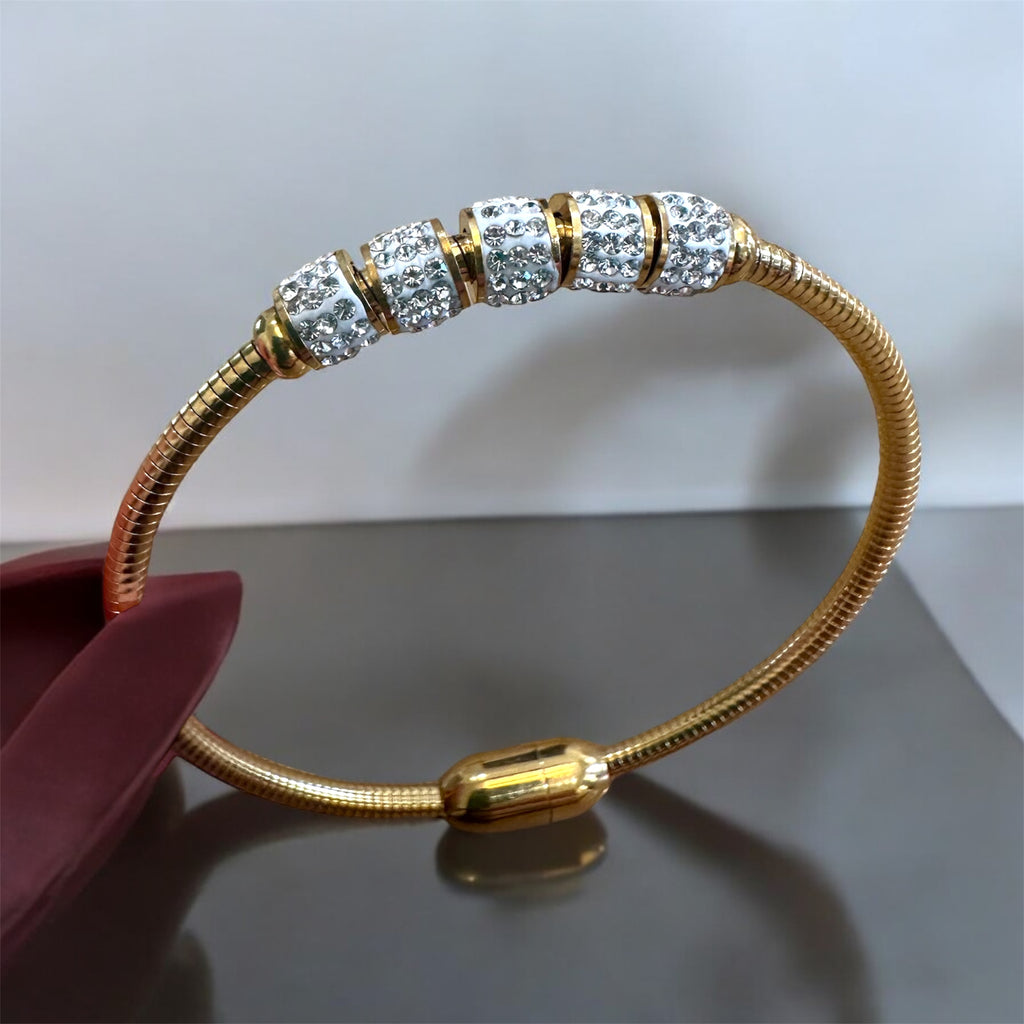 Take a Chance magnetic gold bangle